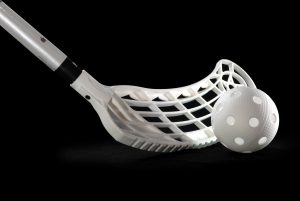 A silver floorball stick and white ball